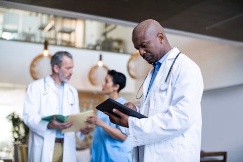 Doctor Using Digital Tablet in Hospital