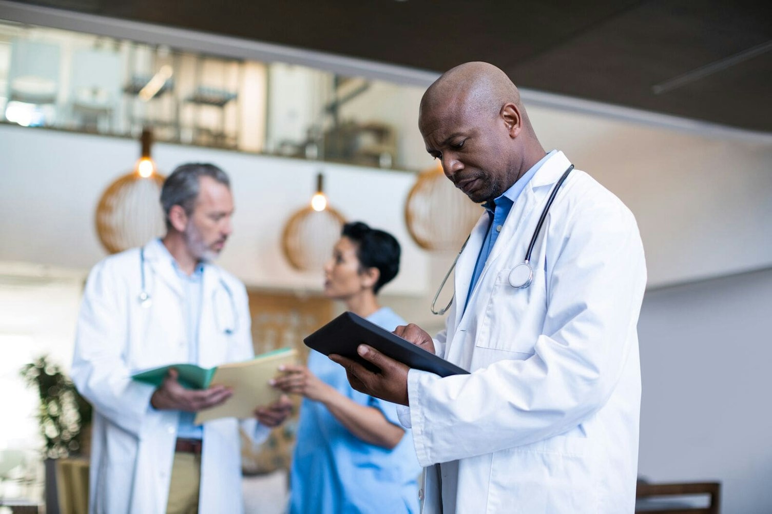 Doctor Using Digital Tablet