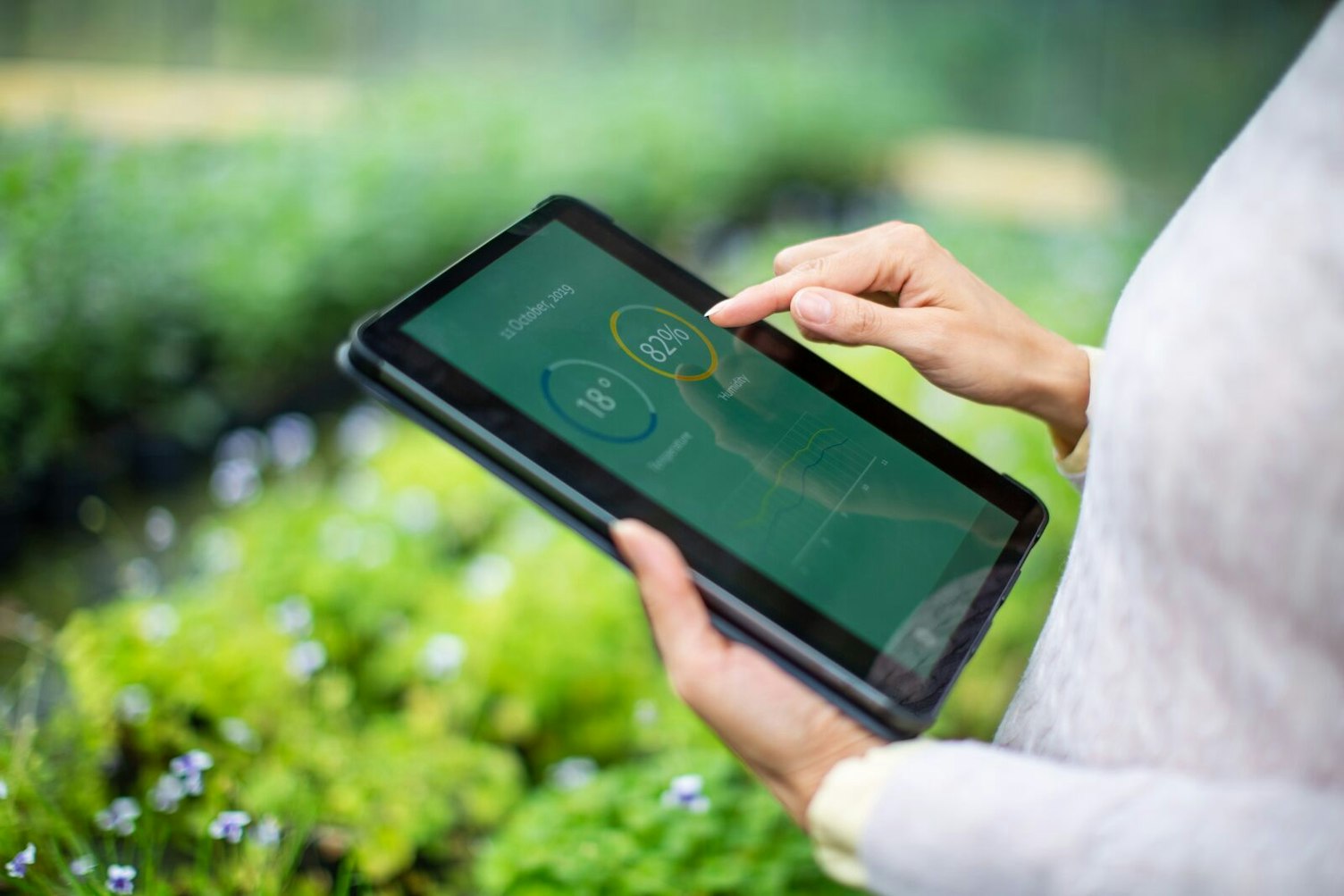 Agricultural Scientist Using Digital Tablet with Measuring System in Greenhouse NoFocalPoint