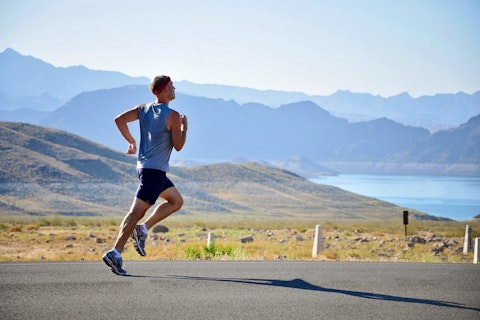 Athletic man running in the country side
