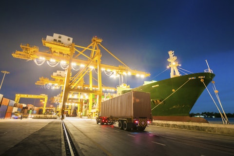 Cargo ship in the port at dusk