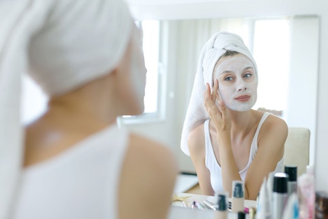 Woman Applying Beauty Mask