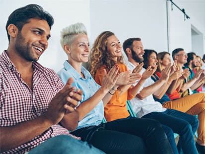 Business People Applauding after a Presentation
