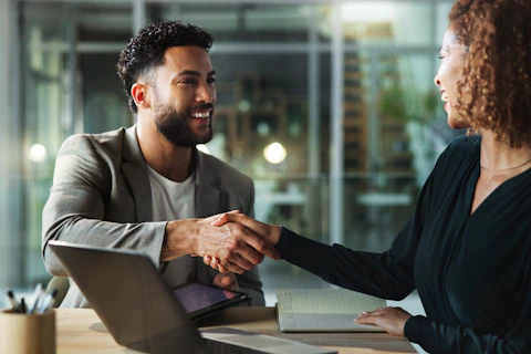 People smile and handshake in office for business company welcome and deal at tech Happy man woman a