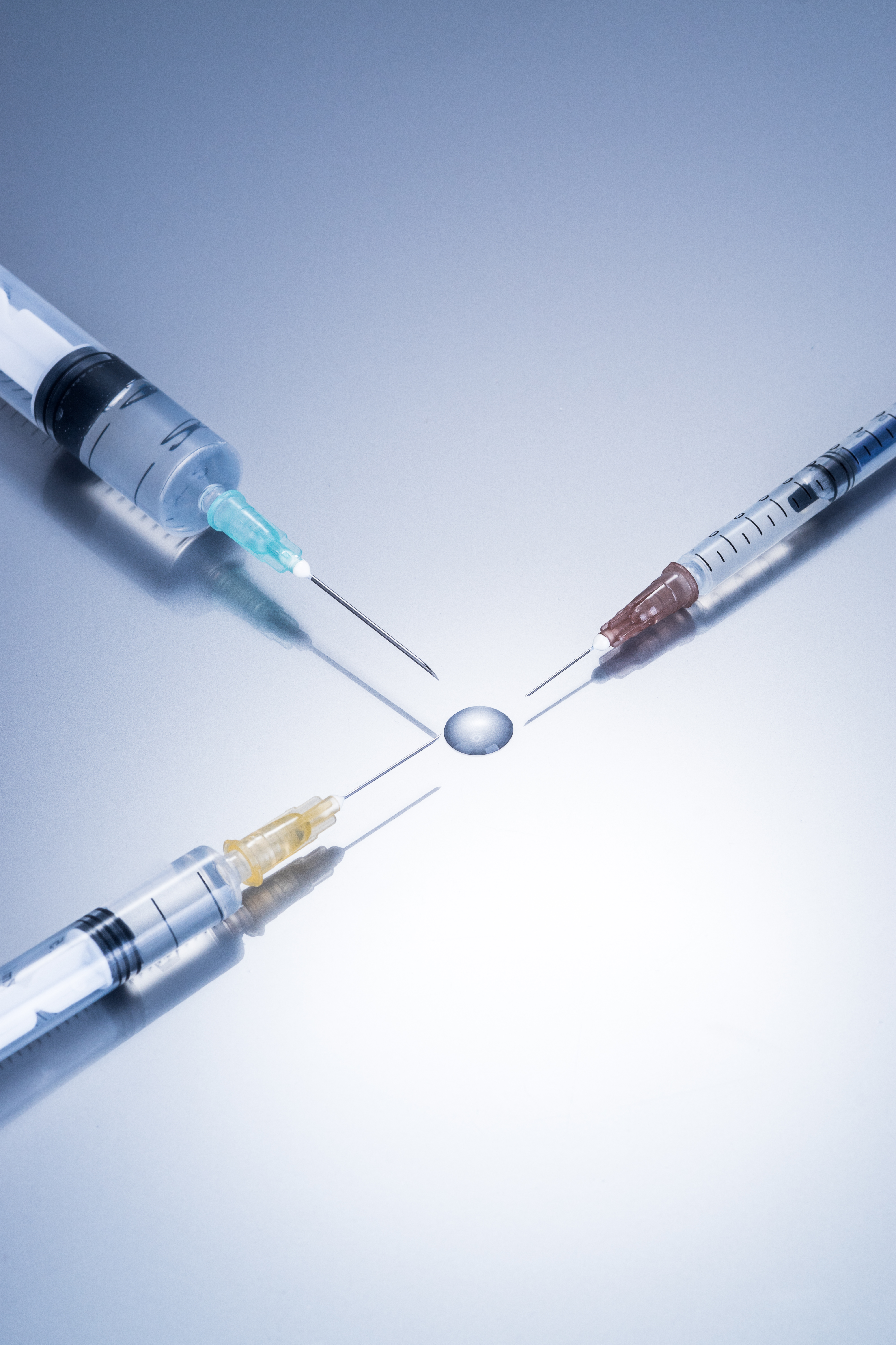 Syringes and droplet close up