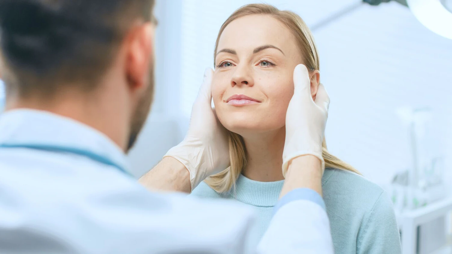 Woman Having Facial Skin Examination in Cosmetology Clinic