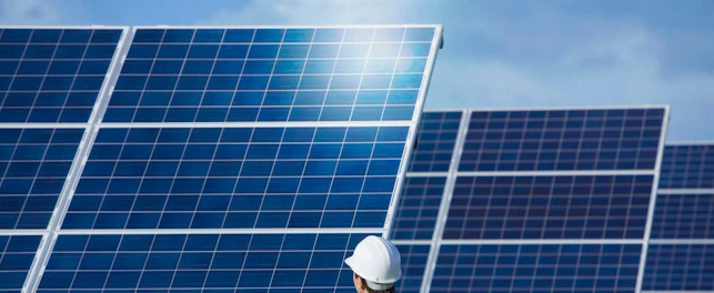 Engineer Inspecting Solar Panels