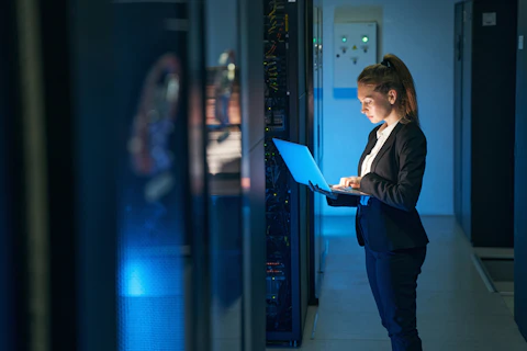 Engineer Working in Server Room
