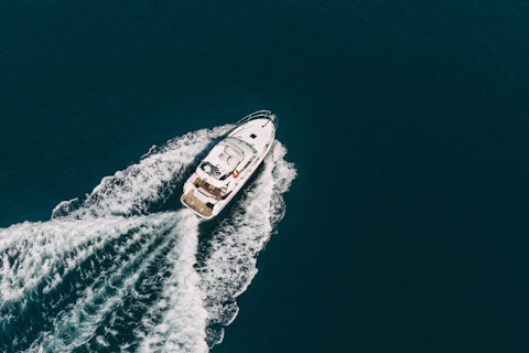 orig motorboat at sea-unsplash
