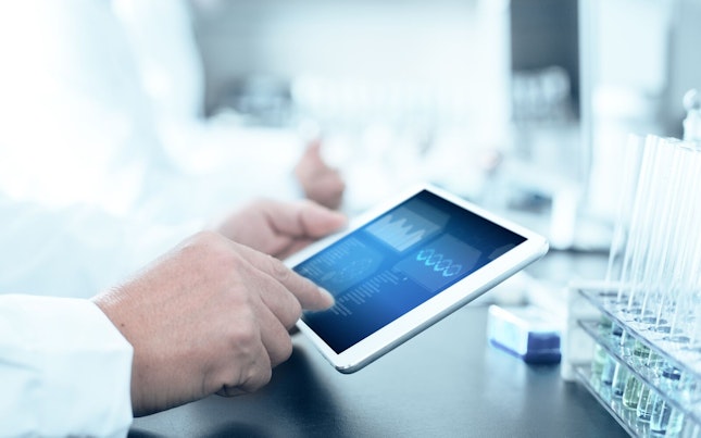 Analyzing Data on Digital Tablet in Laboratory