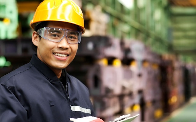 Auditor Carrying an Inspection at a Factory