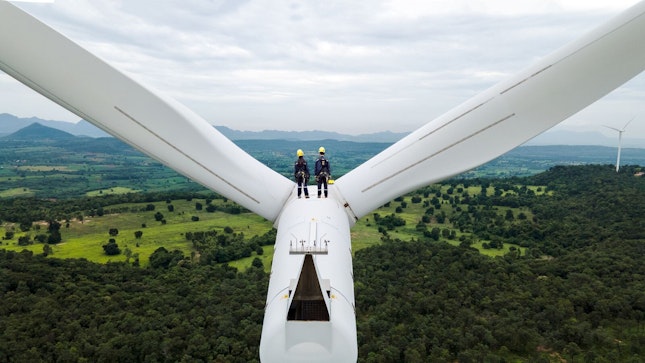 Electric Engineers Working on top of a Wind Turbine