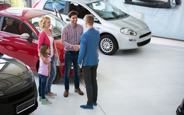 Family at Car Dealer Shop