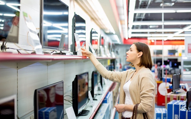 Woman Buying a TV in Store