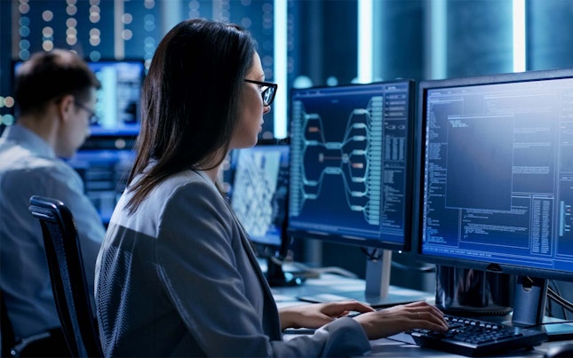 Woman working on monitor